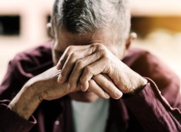 Senior,Man,Covering,His,Face,With,His,Hands.vintage,Tone